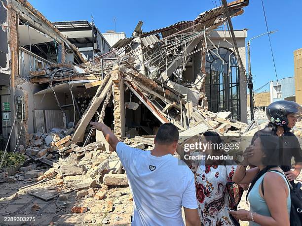 People gather in the streets after a powerful earthquake struck Colombia, killing at least 18 people and causing damage in Pereira, Colombia, on...