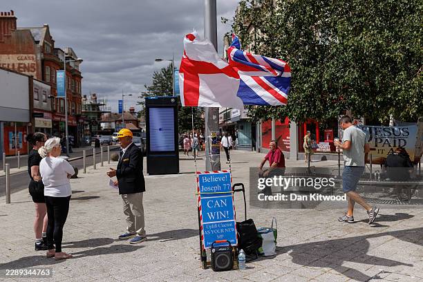 Independent candidate Joseph 77, speaks with members of the public in the town square on August 06, 2026 in Clacton-on-Sea, England. The Clacton...