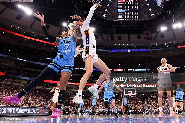 Sophie Cunningham of the Indiana Fever is fouled by DiJonai Carrington of the Chicago Sky during the first half at United Center on August 08, 2026...
