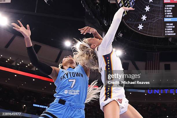 Sophie Cunningham of the Indiana Fever is fouled by DiJonai Carrington of the Chicago Sky during the first half at United Center on August 08, 2026...
