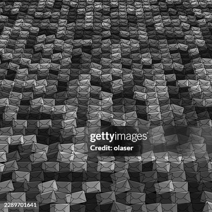 A dense field of small angular grayscale polygons forms a textured surface with repeating faceted shapes, creating a layered geometric pattern and subtle depth across the frame. A dense field of small angular grayscale polygons forms a textured surface with repeating faceted shapes, creating a layered geometric pattern and subtle depth across the frame.