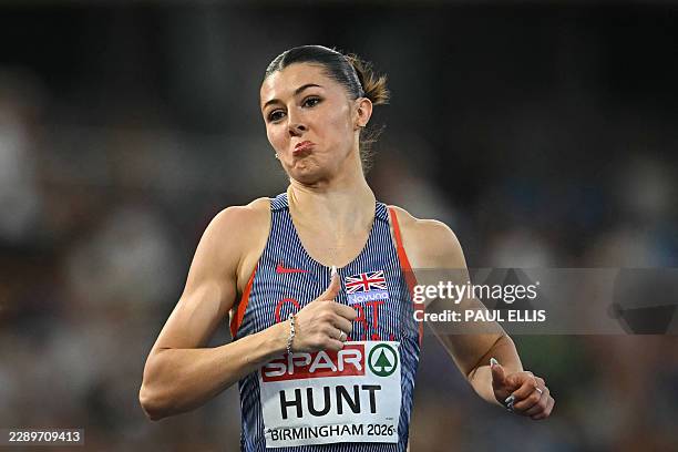First-placed Britain's Amy Hunt celebrates as she crosses the finish line to compete in the women's 200m semi-final 2 during the European Athletics...