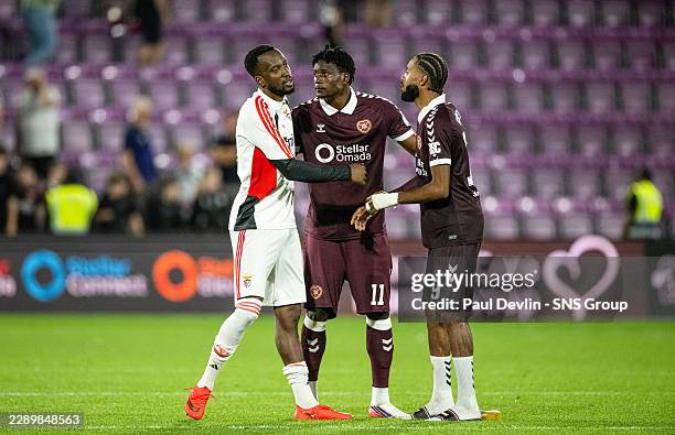 Benfica's Dodi Lukebakio prays with Hearts' Pierre Landry Kabore and Sabri Guendoz during a UEFA Europa League Third Qualifying Round Second Leg...