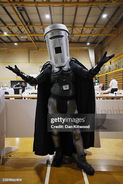 Jon Harvey, dressed as the satirical character Count Binface, poses for the press at Clacton Leisure Centre as election workers review ballots after...