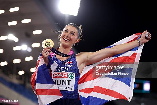Gold medalist Amy Hunt of Team Great Britain poses for a photo with the national flag after victory in the Women's 100 Metres Final during day one of...