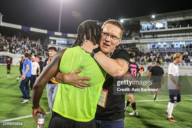 Head coach of Sabah Valdas Dambrauskas celebrates winning after the UEFA Champions League Third Qualifying Round 2nd leg between Sabah and Aarhus at...