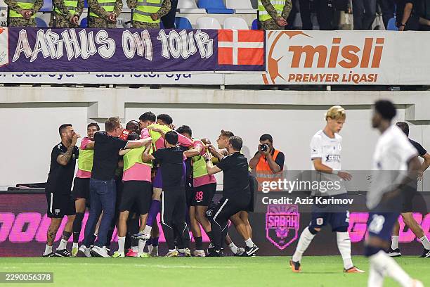 Xander Severina of Sabah celebrates scoring his team's fourth goal with teammates during the UEFA Champions League Third Qualifying Round 2nd leg...