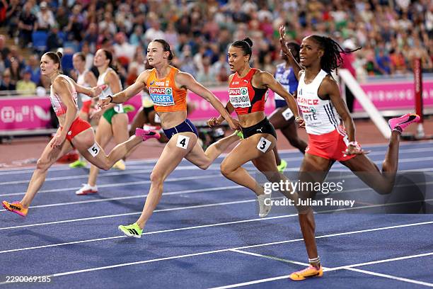 Nadine Visser of Team Netherlands and Ditaji Kambundji of Team Switzerland compete in the Women's 100 Metres Hurdles Final during day two of the 27th...