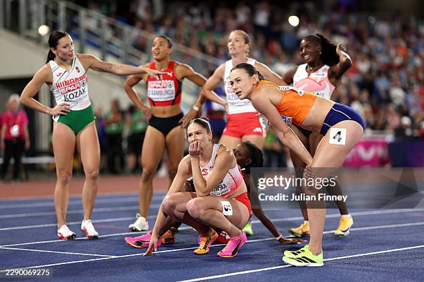 Nadine Visser of Team Netherlands and Pia Skrzyszowska of Team Poland look on after competing in the Women's 100 Metres Hurdles Final during day two...