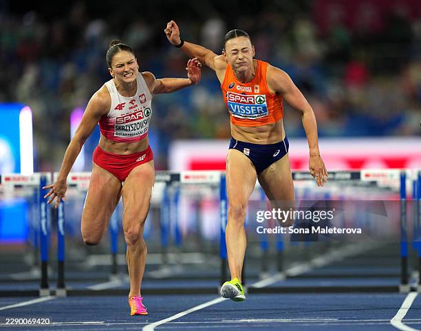 Nadine Visser of Team Netherlands and Pia Skrzyszowska of Team Poland compete in the Women's 100 Metres Hurdles Final during day two of the 27th...