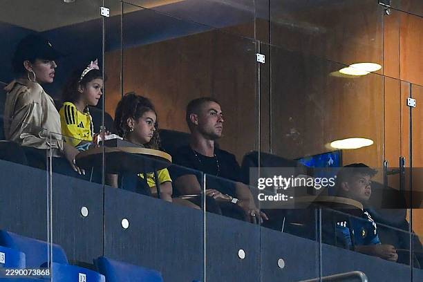 Al-Nassr's Portuguese forward Cristiano Ronaldo , his wife Georgina Rodriguez and their children are seen at the VIP box during the Saudi Pro League...