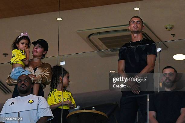 Al-Nassr's Portuguese forward Cristiano Ronaldo , his wife Georgina Rodriguez and their children are seen at the VIP box during the Saudi Pro League...