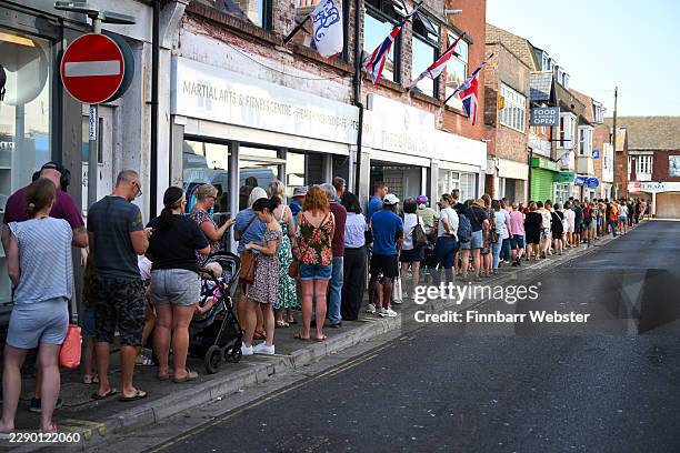 People queue around the block from 6am to buy eclipse glasses after Howleys Toymaster shop collected 10,000 pairs from the Midlands after high...