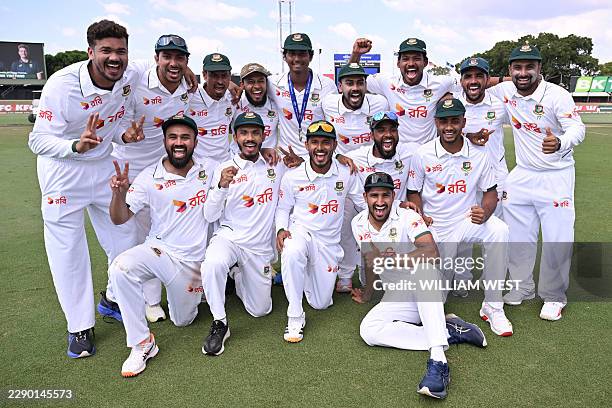 Bangladesh players pose for a photo after their team's victory on the fourth day of the first cricket Test match between Australia and Bangladesh at...
