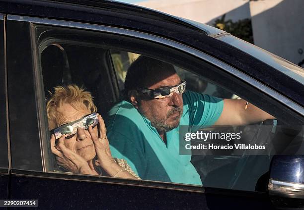 Locals and tourists gather to witness the solar eclipse in Cabo da Roca, one of the most iconic spots near Lisbon and the westernmost point of...