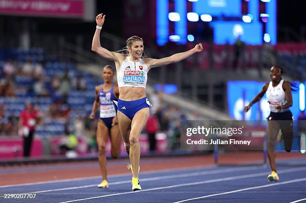 Emma Zapletalova of Team Slovakia celebrates as she crosses the finish line to win the gold medal in the Women's 400 Metres Hurdles Final during day...