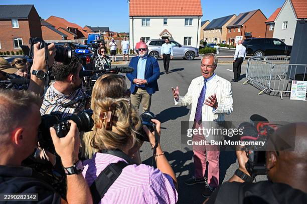 Nigel Farage speaks to the media after casting his vote during the Clacton By-election on August 13, 2026 in Clacton-on-Sea, England. The...
