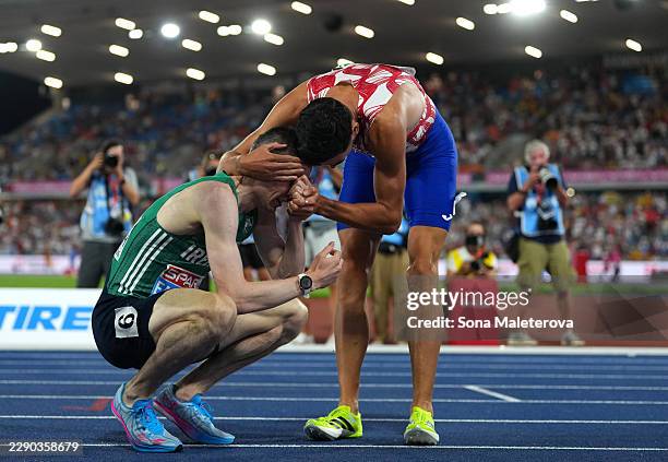 Gold medalist Mark English of Team Ireland is congratulated by Silver medalist Marino Bloudek of Team Croatia after the Men's 800 Metres Final during...