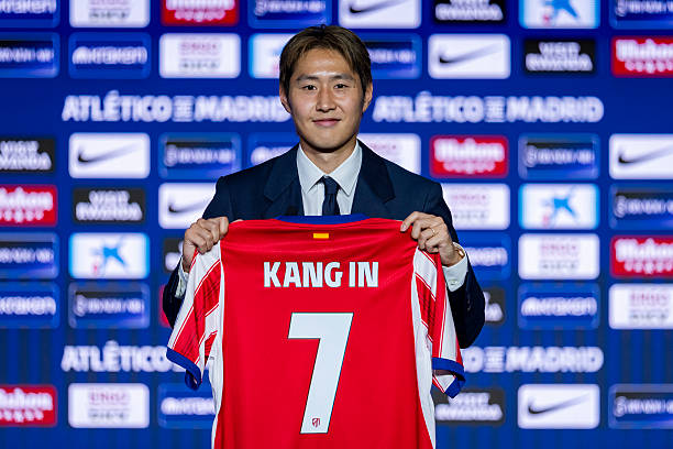 Kang-In Lee poses for a photo showing the club shirt during his unveiling as a new player of Atletico de Madrid at Estadio Riyadh Air Metropolitano...