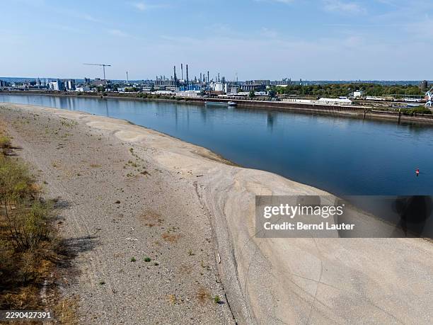 An aerial view shows exposed sandbanks along the Rhine River on August 16, 2026 in Wesseling, Germany. The Rhine River water level has reached record...