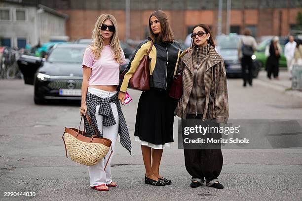 Guest is seen wearing oversized black sunglasses; a pink cropped T shirt; white trousers; red flip flops; with her long blonde hair worn loose; a...
