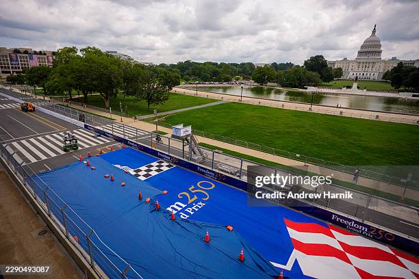 The U.S. Capitol Building is visible at the finish line of the Indy Car race track for the Freedom 250 Grand Prix on August 18, 2026 in Washington,...