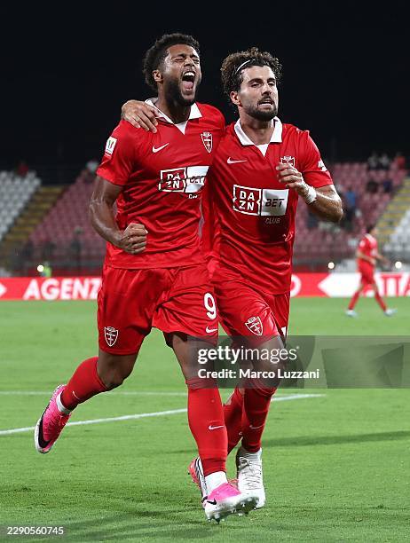 Gustavo Varela of AC Monza celebrates with his team-mate Patrick Cutrone after scoring their team's first goal during the Coppa Italia match between...