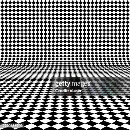 Black and white diamond checkered pattern forms a warped floor and wall, creating strong perspective and a repeating geometric surface with a striking optical illusion. Black and white diamond checkered pattern forms a warped floor and wall, creating strong perspective and a repeating geometric surface with a striking optical illusion.