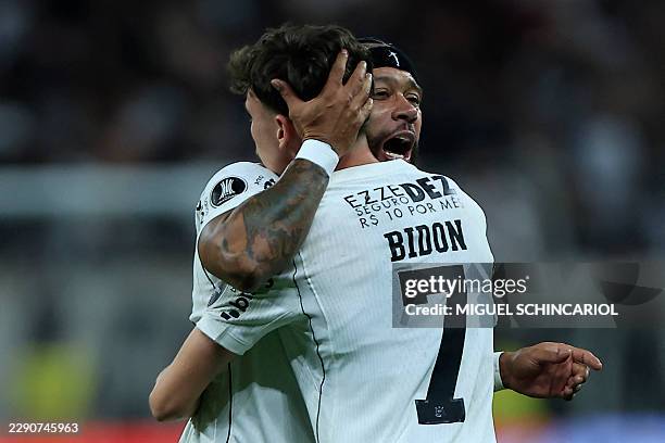 Corinthians' midfielder Breno Bidon celebrates scoring his team's first goal with Corinthians' Dutch forward Memphis Depay during the second leg of...