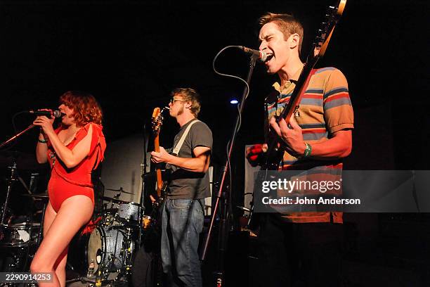 Members of American Punk Rock group A Giant Dog perform onstage at Red 7, Austin, Texas, April 11, 2012. Pictured are, from left, Sabrina Ellis, on...