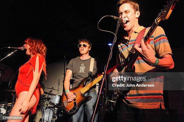 Members of American Punk Rock group A Giant Dog perform onstage at Red 7, Austin, Texas, April 11, 2012. Pictured are, from left, Sabrina Ellis, on...