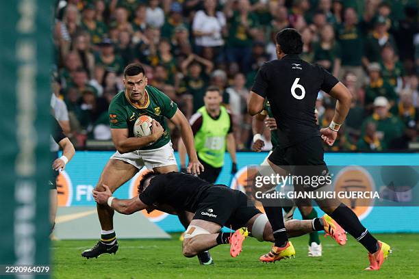 South Africa's centre Damian de Allende is tackled during the Rugby's Greatest Rivalry international rugby union match between South Africa and New...