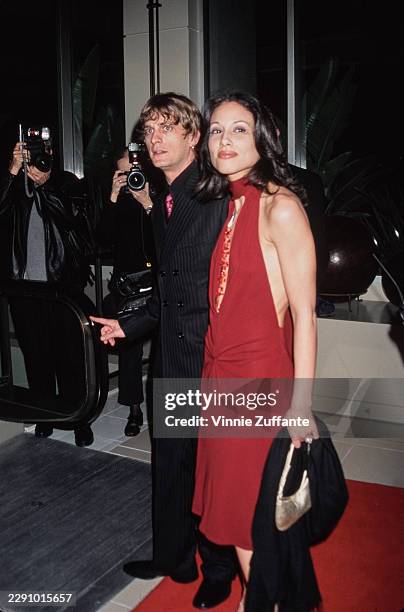 American singer, songwriter and guitarist Rob Thomas, Matchbox Twenty frontman, and his wife, Marisol, attend the 2001 MusiCares 'Person of the Year'...