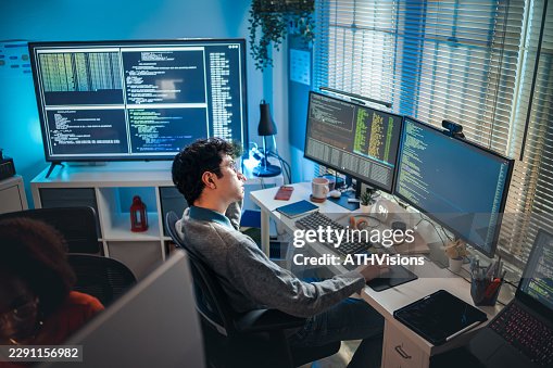 Software Developer Working with Multiple Monitors Software Developer Working with Multiple Monitors