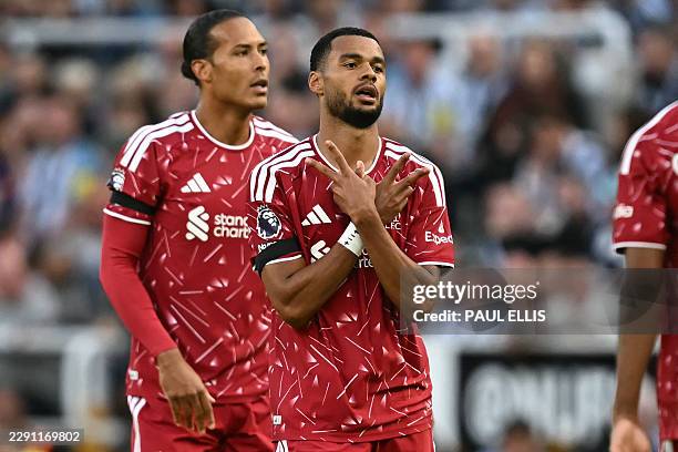 Liverpool's Dutch striker Cody Gakpo reacts to scoring their first goal during the English Premier League football match between Newcastle United and...