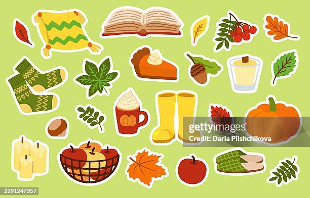 a cute collection of autumn sticker elements featuring cozy socks, pumpkin pie, warm drinks, leaves, and seasonal decor - thanksgiving crafts stock illustrations
