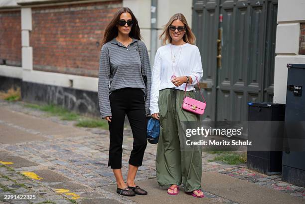 Lisa Ifi is seen wearing a gray striped long sleeve polo shirt; black cropped trousers; black mesh Mary Jane flats; a black quilted shoulder bag; a...