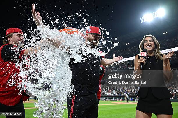 Jake Rogers of the Chicago White Sox gets water dumped on him after hitting a two run walk-off home run against the New York Mets during the ninth...