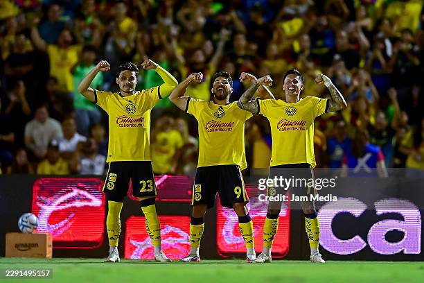 Henry Martin of America celebrates with Raphael Cavalcante and Paul Brian Rodriguez after scoring the team's second goal during the 5th round match...