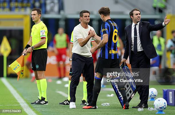 John Stones of Internazionale shakes hands with Cristian Chivu, Head Coach of Internazionale before coming on as a substitute during the Serie A...