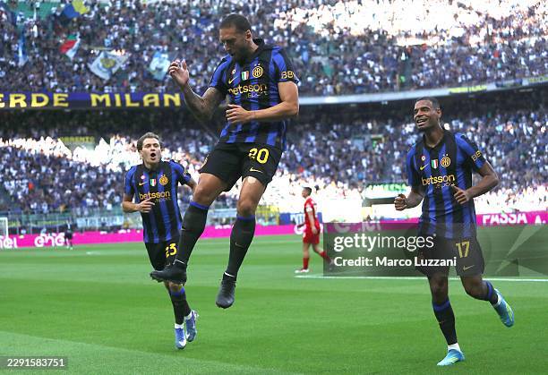 Hakan Calhanoglu of FC Internazionale celebrates after scoring their team's first goal during the Serie A match between FC Internazionale and AC...