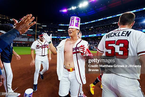 Ha-Seong Kim of the Atlanta Braves celebrates with teammates after hitting a walk-off single in the ninth inning during the game against the Los...