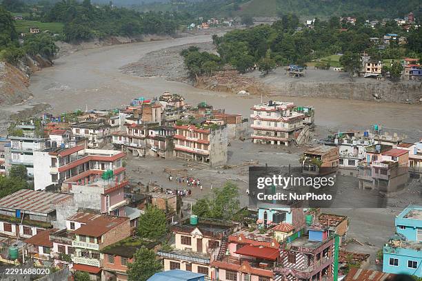 Damaged section of a highway in Nuwakot, central Nepal, is seen on August 27 following a glacial lake outburst in Tibet. Rescue teams collect bodies,...