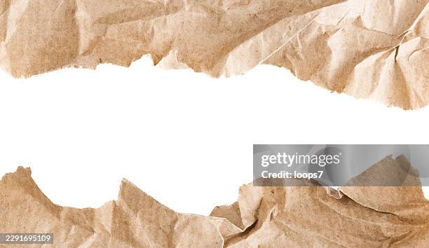torn brown kraft paper frame with white copy space - torn parchment stock illustrations