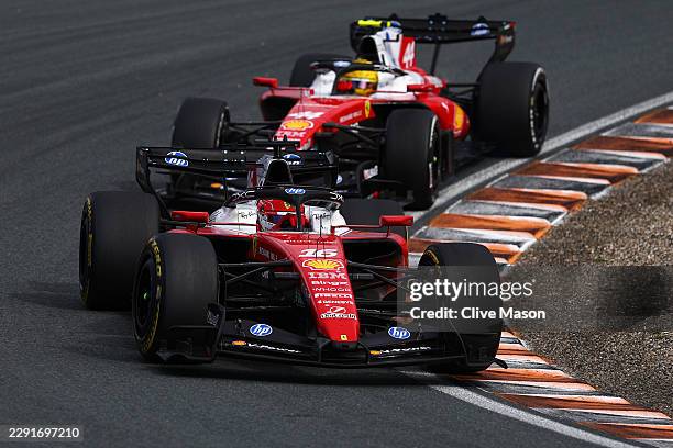 Charles Leclerc of Monaco driving the Scuderia Ferrari SF-26 leads Lewis Hamilton of Great Britain driving the Scuderia Ferrari SF-26 on track during...
