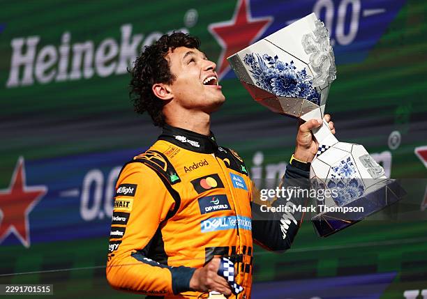 Race winner Lando Norris of Great Britain and McLaren celebrates on the podium with his trophy during the F1 Grand Prix of Netherlands at Circuit...
