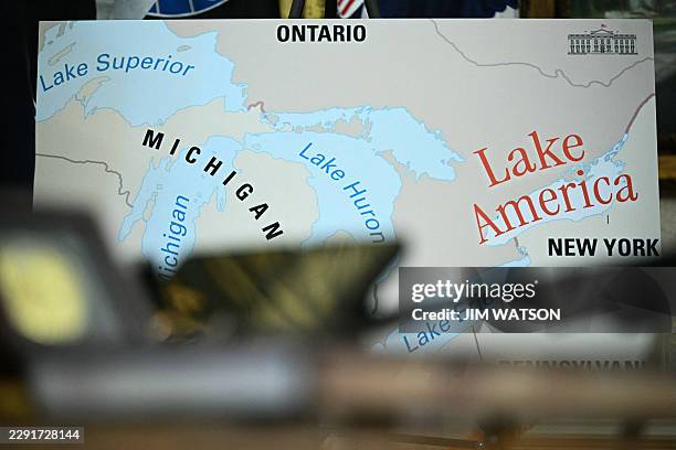 Map is displayed as US President Donald Trump signs an executive order that aims to rename Lake Ontario to Lake America in the Oval Office of the...