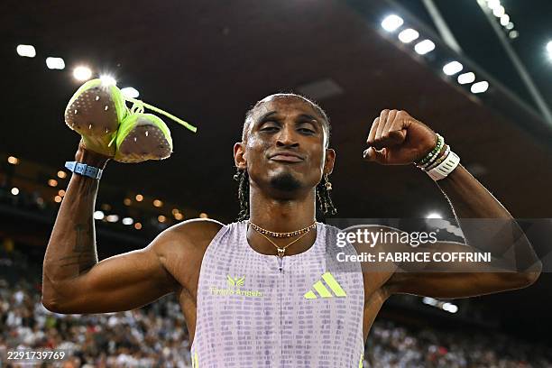 Brazil's Alison dos Santos celebrates after winning and breaking the world record in the men's 400m hurdles during the IAAF Diamond League athletics...