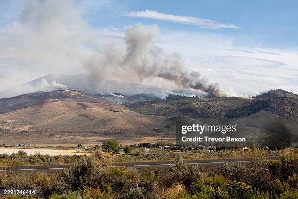 The Hawk Fire burns on August 23, 2026 in Reno, Nevada. The wildfire spread from the Sierra foothills towards Reno, forcing thousands to evacuate...