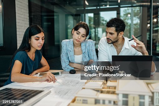 Architects team working on project plan. Architects team working on project plan.